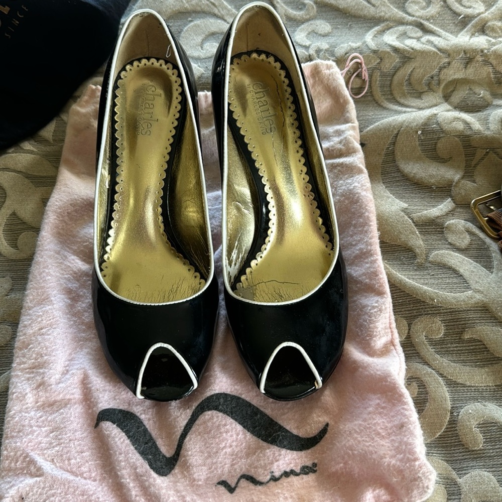 Black with white trim. Size 9 peek a boo heel